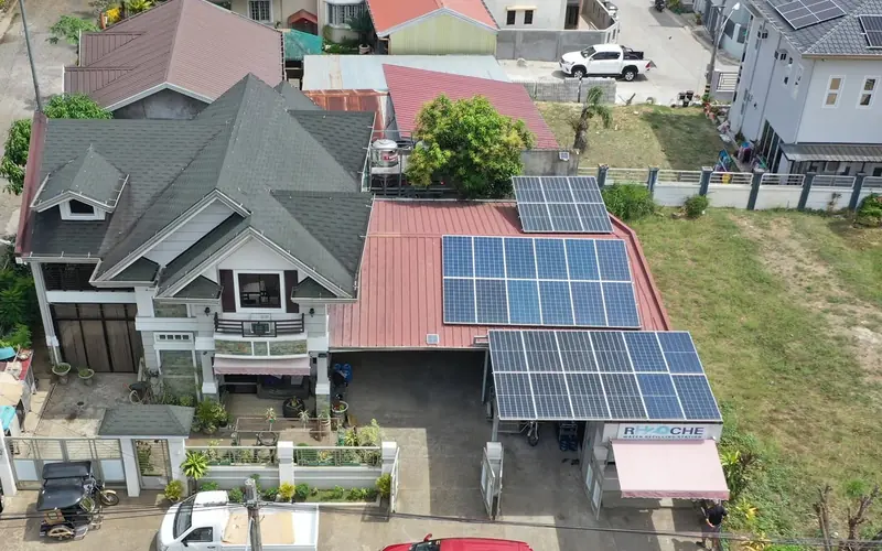 Aerial view of a home with a rooftop solar array